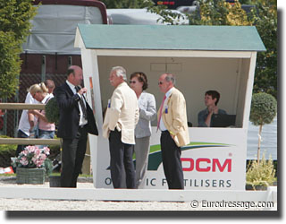 Judges, discussing what to do with Sonke Rothenberger's ride and the "illegal" banner.