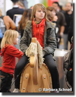 kid on a wooden horse