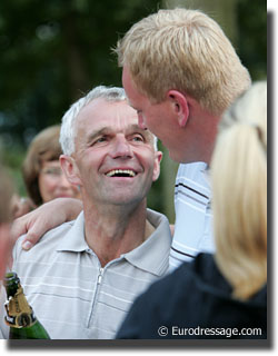 Honnerups's Jorgensen being congratulated by Esben Moller of Blue hors Stud