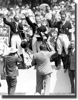 Mexico City, 25 October 1968 Games of the XIX Olympiad. On the podium for the individual dressage, Riders from the Federal Republic of Germany Josef NECKERMANN 2nd with MARIANO and Reiner KLIMKE 3rd with DUX surround Ivan KIZIMOV of the Soviet Union 1st with IJOR