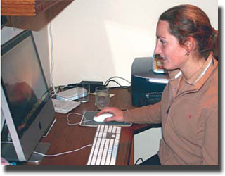 Maria Eilberg behind the computer